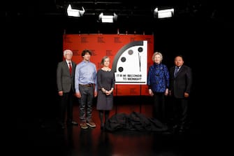 WASHINGTON, DC - JANUARY 24: (L-R) Members of the Bulletin of the Atomic Scientists Siegfried S. Hecker, Daniel Holz, Sharon Squassoni, Mary Robinson and Elbegdorj Tsakhia stand for a photo with the 2023 Doomsday Clock ahead of a live-streamed event on January 24, 2023 in Washington, DC. This year the Doomsday Clock is set at ninety seconds to Midnight (Photo by Anna Moneymaker/Getty Images)