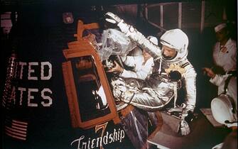 376869 01: Astronaut John Glenn, Jr. is loaded into the Friendship 7 capsule in preparation for flight on the Mercury Titan rocket February 20, 1962