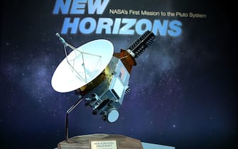 480809730 LAUREL, MD - JULY 15: A model of the New Horizons spacecraft that passed with 7,800 miles of Pluto yesterday, is on display at a NASA news conference July 15, 2015 in Laurel, Maryland. Images from the flyby are being released as they become available. The 1,050-pound piano sized probe, which was launched January 19, 2006 aboard an Atlas V rocket from Cape Canaveral, Florida, zipped by the planet yesterday. (Photo by Mark Wilson/Getty Images)