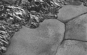 SPACE PLUTO SCIENCE METHANE DUNES epa06777226 A handout photo made available by NASA on 01 June 2018 shows suspected dunes on Pluto in this image acquired by NASA's New Horizons spacecraft during its 14 July 2015 flyby. An international team of scientists said on 31 May 2018, that dunes, possibly composed of sand-sized grains of solid methane ice, have been identified in the Sputnik Planitia region of the dwarf planet. The team analyzed the images of Pluto taken in 2015 by NASA's New Horizon spacecraft. EPA/NASA/JHUAPL/SwRI HANDOUT HANDOUT EDITORIAL USE ONLY/NO SALES