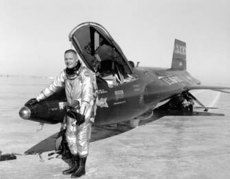 Dryden pilot Neil Armstrong poses next to the X-15 ship 1 rocket-powered aircraft after a research flight, November 30, 1959. Image courtesy National Aeronautics and Space Administration (NASA). (Photo by Smith Collection/Gado/Getty Images)