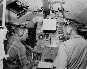 Picture dated of 1969 showing US Astronauts Neil Armstrong (L) and Buzz Aldrin practicing in a simulator prior to their mission on the moon on the Apollo XI space mission. (Photo by - / various sources / AFP) (Photo by -/NASA/AFP via Getty Images)