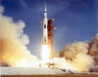 The Apollo 11 Saturn V space vehicle lifts off 16 July 1969 with astronauts Neil A. Armstrong, Michael Collins, and Edwin E. Aldrin aboard.  Druing the eight day mission, Armstrong and Aldrin descended to the the moon for 22 hours, including 2 and 1/2 hours outside the lunar module, while Collins orbited overhead in the command module.  Armstrong and Aldrin gathered samples of lunar material and deployed scientific experiments before joining Collins for the return trip to Earth.  AFP PHOTO/NASA (Photo by NASA / NASA / AFP)        (Photo credit should read NASA/AFP via Getty Images)