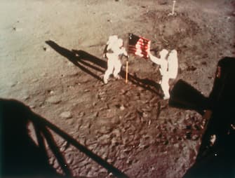 Armstrong and Aldrin unfurl the US flag on the moon, 1969. Apollo 11, the first manned lunar landing mission, was launched on 16 July 1969 and Neil Armstrong and Edwin Aldrin became the first and second men to walk on the moon on 20 July 1969. The third member of the crew, Michael Collins, remained in lunar orbit. (Photo by Oxford Science Archive/Print Collector/Getty Images)