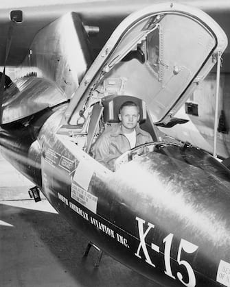 First man on the moon and X-15 NASA pilot Neil Armstrong, sits in aircraft.