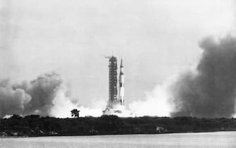16th July 1969:  The Apollo 11 Saturn V rocket lifts off its pad at Kennedy Space Centre in Florida, carrying astronauts Neil Armstrong, Buzz Aldrin, and Michael Collins to man's first landing on the surface of the moon.  (Photo by Arnold Sachs/Keystone/CNP/Getty Images)