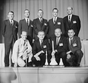 (Original Caption) Houston: NASA announced the names of nine new astronauts at a press conference here. Here with the models of Mercury, Apollo and Gemini space crafts are rear L-R: Elliot M. See, Jr., James A. McDivitt, James A. Lovell, Edward M. White, and Thomas F. Stafford. Front L-R: Charles Conrad Jr., Frank Borman, Neil A. Armstrong, and John W. Young.