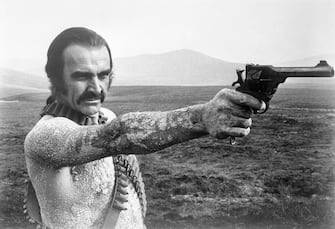 Sean Connery aims a gun in the 1974 film Zardoz. Connery played the role of Zed, a barbarian in a future world.