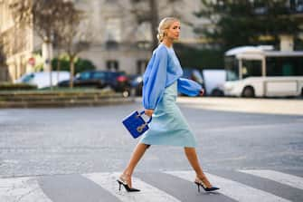 PARIS, FRANCE - JANUARY 21: Leonie Hanne wears a blue ruffled top, a pale blue skirt, a blue Lady Dior bag, Dior pointy shoes, during Paris Fashion Week - Haute Couture Spring/Summer 2020, on January 21, 2020 in Paris, France. (Photo by Edward Berthelot/Getty Images )