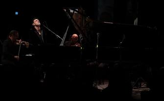 884577984 TURIN, ITALY - DECEMBER 02: Italian musician and composer Ezio Bosso performs live on stage during Piano Lessons: Ezio Bosso At Ogr in Turin on December 2, 2017 in Turin, Italy. (Photo by Emilio Andreoli/Getty Images for OGR)
