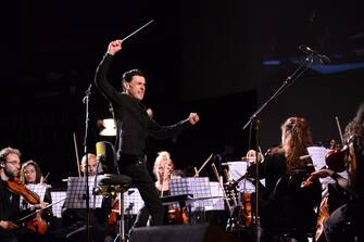 BOLOGNA, ITALY - JUNE 20:  Italian musician and composer Ezio Bosso performs with the Collegium Musicum Almae Matris Orchestra for the ReUniOn of ex students of the UniversitÃ  degli Studi of Bologna Alma Mater Studiorum at Piazza Maggiore  on June 20, 2015 in Bologna, Italy.  (Photo by Roberto Serra - Iguana Press/Getty Images)