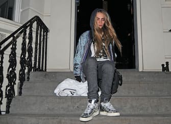 LONDON, UNITED KINGDOM - FEBRUARY 19: Cara Delevigne is seen taking a stumble on the stairs as she leaves house party on February 19, 2013 in London, United Kingdom.  (Photo by JJ/Bauer-Griffin/GC Images)