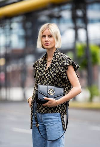 DUSSELDORF, GERMANY - JUNE 09: Lisa Hahnbueck is seen wearing Louis Vuitton logo prinz silk blouse, Goldsign jeans, Louis Vuitton Pont Neuf 9 bag on June 09, 2020 in Dusseldorf, Germany. (Photo by Christian Vierig/Getty Images)