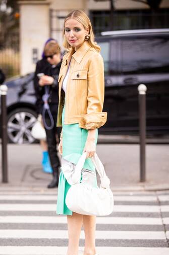 PARIS, FRANCE - MARCH 03: Leonie Hanne, wearing a white top, beige leather jacket, teal midi skirt and white bag, is seen outside Miu Miu, during Paris Fashion Week - Womenswear Fall/Winter 2020/2021 : Day Nine on March 03, 2020 in Paris, France. (Photo by Claudio Lavenia/Getty Images)