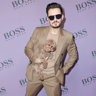 MILAN, ITALY - FEBRUARY 23: Orlando Bloom with his dog Mighty attend the Boss fashion show on February 23, 2020 in Milan, Italy. (Photo by Jacopo Raule/WireImage)