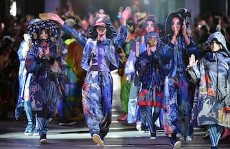 Models display creations during the fashion event "super energy !!" produced by Japanese designer Kansai Yamamoto in Tokyo on June 12, 2015. AFP PHOTO / KAZUHIRO NOGI        (Photo credit should read KAZUHIRO NOGI/AFP via Getty Images)