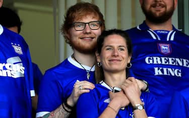 IPSWICH, ENGLAND - APRIL 21:  Musician Ed Sheeran and fiance Cherry Seaborn look on during the Sky Bet Championship match between Ipswich Town and Aston Villa at Portman Road on April 21, 2018 in Ipswich, England. (Photo by Stephen Pond/Getty Images)