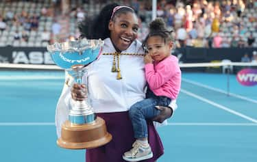 Serena Williams of the US with her daughter Alexis Olympia after her win against Jessica Pegula of the US during their women's singles final match during the Auckland Classic tennis tournament in Auckland on January 12, 2020. (Photo by MICHAEL BRADLEY / AFP) (Photo by MICHAEL BRADLEY/AFP via Getty Images)