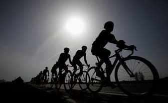 GENT, BELGIUM - MARCH 30:  A general view of the peloton silhouetted against the sun during the Gent-Wevelgem Cycle Race on March 30, 2014 in Gent, Belgium.  (Photo by Dean Mouhtaropoulos - Velo/Getty Images)