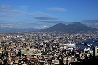 A picture taken from a terrace shows the city of Naples and the Vesuvius volcano on January 9, 2016 in Naples.  AFP PHOTO / GABRIEL BOUYS / AFP / GABRIEL BOUYS        (Photo credit should read GABRIEL BOUYS/AFP via Getty Images)