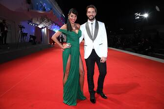 VENICE, ITALY - SEPTEMBER 12: Delia Duran and Alex Belli walk the red carpet of the movie "Lasciami Andare" after the closing ceremony at the 77th Venice Film Festival on September 12, 2020 in Venice, Italy. (Photo by Pascal Le Segretain/Getty Images)