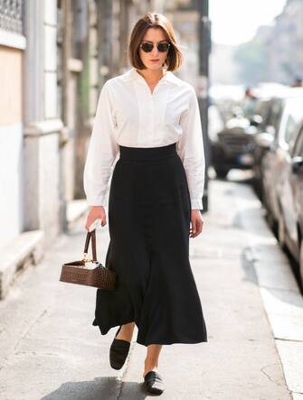 1036128690 MILAN, ITALY - SEPTEMBER 19: A guest is seen outside Jil Sander during Milan Fashion Week Spring/Summer 2019 on September 19, 2018 in Milan, Italy. (Photo by Christian Vierig/Getty Images)