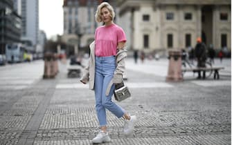 1134416584 BERLIN, GERMANY - MARCH 07: Mandy Bork wearing Saint Laurent shirt, Burberry trench coat, Bulgari bag, Balenciaga Triple S, Nakd jeans, Cartier jewelry and Dior earrings on March 07, 2019 in Berlin, Germany. (Photo by Jeremy Moeller/Getty Images)