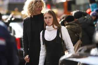 NEW YORK, NEW YORK - FEBRUARY 08: Lila Moss, daughter of Kate Moss, wears a white wool knitted turtleneck pullover, black overalls, outside Longchamp, during New York Fashion Week Fall-Winter 2020, on February 08, 2020 in New York City. (Photo by Edward Berthelot/Getty Images)