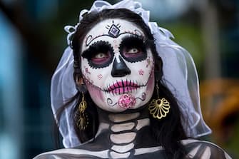 MEXICO CITY, MEXICO - OCTOBER 23: Portrait of a participant who wears a skeleton makeup and parades through the streets during the 'Catrinas Parade', a joyful annual event celebrated at the Day of the Dead (Dia de Muertos) on October 23, 2016 in Mexico City, Mexico. (Photo by Vincent Isore/IP3/Getty Images)