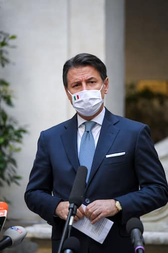 ROME, ITALY - OCTOBER 13: Italian Prime Minister Giuseppe Conte wearing a protective mask holds a press conference on the new safety measures to contain the Covid-19 pandemic, at Palazzo Chigi on October 13, 2020 in Rome, Italy. (Photo by Antonio Masiello#POOL/Alberto Lingria / POOL via Getty Images)