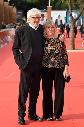 ROME, ITALY - OCTOBER 21:  Gigi Proietti and Sagitta Alter walk the red carpet ahead of the "Sono Gassman! Vittorio Re Della Commedia" screening during the 13th Rome Film Fest at Auditorium Parco Della Musica on October 21, 2018 in Rome, Italy.  (Photo by Daniele Venturelli/WireImage)