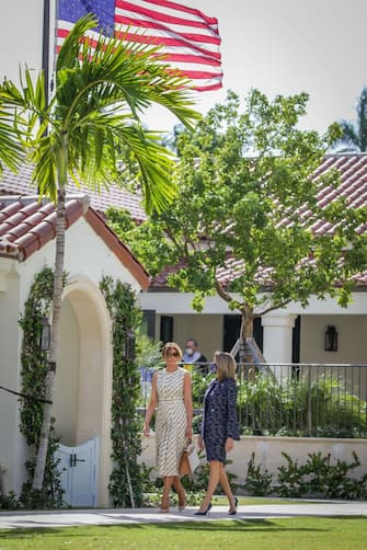 After voting, First Lady Melania Trump(L) leaves the Morton and Barbara Mandel Recreation Center with the Palm Beach County Supervisor of Elections Wendy Sartory Link in Palm Beach, Florida on November, 3, 2020. - The First Lady is registered to vote at her address at the Mar-a-Lago Club in Palm Beach, Florida. The center was closed for approximately 45 minutes to accommodate Mealnia Trumps vote. With its 29 electoral votes, Florida is crucial to both candidates. (Photo by Zak BENNETT / AFP) (Photo by ZAK BENNETT/AFP via Getty Images)