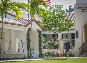 After voting, First Lady Melania Trump(L) leaves the Morton and Barbara Mandel Recreation Center with the Palm Beach County Supervisor of Elections Wendy Sartory Link in Palm Beach, Florida on November, 3, 2020. - The First Lady is registered to vote at her address at the Mar-a-Lago Club in Palm Beach, Florida. The center was closed for approximately 45 minutes to accommodate Mealnia Trumps vote. With its 29 electoral votes, Florida is crucial to both candidates. (Photo by Zak BENNETT / AFP) (Photo by ZAK BENNETT/AFP via Getty Images)