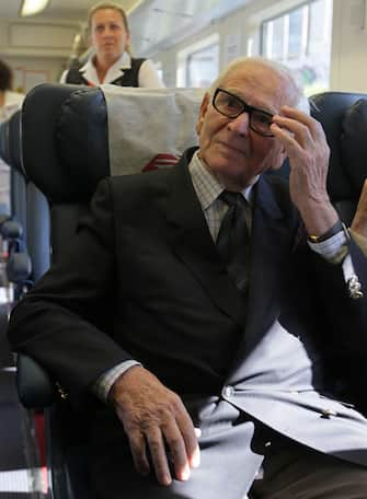 epa02769164 French couturier Pierre Cardin looks on in a train from Sheremetievo airport to Moscow, Russia, 06 June 2011. Cardin arrived in Moscow for his fashion show in the Kremlin and to visit Russian students of Moscow University of Design and Technology.  EPA/SERGEI CHIRIKOV