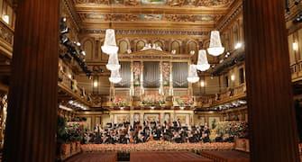 epa08914160 A handout photo made available by Vienna Philharmonic shows the orchestra led by Italian conductor Riccardo Muti (C) performing during the Wiener Philharmoniker (Vienna Philharmonic) New Year's Concert 2021 at the Musikverein concert hall in Vienna, Austria, 01 January 2021. The traditional concert, which is staged every year on 01 January, takes place without audience due to a nationwide lockdown caused by the ongoing Covid-19 coronavirus pandemic.  EPA/DIETER NAGL HANDOUT  HANDOUT EDITORIAL USE ONLY/NO SALES