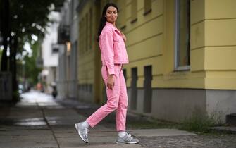 BERLIN, GERMANY - MAY 05: Alyssa Cordes wearing Fabienne Chapot jeans combi, New Balance sneaker and Topshop white shirt on May 05, 2020 in Berlin, Germany. (Photo by Jeremy Moeller/Getty Images)