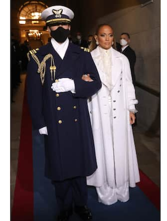 WASHINGTON, DC - JANUARY 20: Jennifer Lopez is escorted to  the inauguration of U.S. President-elect Joe Biden on the West Front of the U.S. Capitol on January 20, 2021 in Washington, DC.  During today's inauguration ceremony Joe Biden becomes the 46th president of the United States. (Photo by Win McNamee/Getty Images)