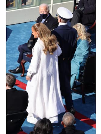 WASHINGTON, DC - JANUARY 20: Jennifer Lopez is escorted to  the inauguration of U.S. President-elect Joe Biden on the West Front of the U.S. Capitol on January 20, 2021 in Washington, DC.  During today's inauguration ceremony Joe Biden becomes the 46th president of the United States. (Photo by Tasos Katopodis/Getty Images)