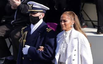 WASHINGTON, DC - JANUARY 20: Jennifer Lopez is escorted to the inauguration of U.S. President-elect Joe Biden on the West Front of the U.S. Capitol on January 20, 2021 in Washington, DC.  During today's inauguration ceremony Joe Biden becomes the 46th president of the United States. (Photo by Alex Wong/Getty Images)