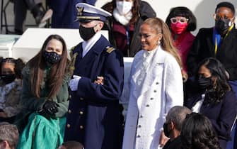 WASHINGTON, DC - JANUARY 20: Jennifer Lopez is escorted to the inauguration of U.S. President-elect Joe Biden on the West Front of the U.S. Capitol on January 20, 2021 in Washington, DC.  During today's inauguration ceremony Joe Biden becomes the 46th president of the United States. (Photo by Alex Wong/Getty Images)