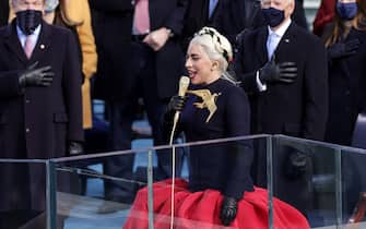 WASHINGTON, DC - JANUARY 20: Lady Gaga sings the National Anthem at the inauguration of U.S. President-elect Joe Biden on the West Front of the U.S. Capitol on January 20, 2021 in Washington, DC.  During today's inauguration ceremony Joe Biden becomes the 46th president of the United States. (Photo by Alex Wong/Getty Images)