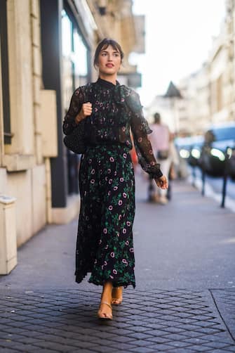 PARIS, FRANCE - JULY 03: Jeanne Damas wears a floral print black mesh dress, a bag, outside Valentino, during Paris Fashion Week -Haute Couture Fall/Winter 2019/2020, on July 03, 2019 in Paris, France. (Photo by Edward Berthelot/Getty Images)