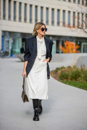 FRANKFURT AM MAIN, GERMANY - OCTOBER 26: Victoria Scheu is seen wearing sheath dress with tie Zara, Chunky Boots Zara, sunglasses Dior, oversized blazer Ralph Lauren Vintage, olive green bag BV Classic Bottega Veneta on October 26, 2020 in Frankfurt am Main, Germany. (Photo by Christian Vierig/Getty Images)