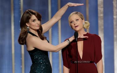 BEVERLY HILLS, CA - JANUARY 13: In this handout photo provided by NBCUniversal,  L to R Tina Fey and Amy Poehler host the 70th Annual Golden Globe Awards at the Beverly Hilton Hotel International Ballroom on January 13, 2013 in Beverly Hills, California. (Photo by Paul Drinkwater/NBCUniversal via Getty Images)