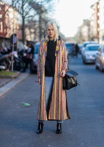 MILAN, ITALY - JANUARY 16: Linda Tol wearing a mulit color striped coat, black bag, black hoody at Etro during Milan Men's Fashion Week Fall/Winter 2017/18 on January 16, 2017 in Milan, Italy. (Photo by Christian Vierig/Getty Images)