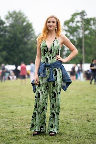 CHICAGO, IL - JULY 22:  A guest is seen attending Pitchfork Music Festival wearing leaf pattern bodysuit with denim jacket around the waist at Union Park on July 22, 2018 in Chicago, Illinois.  (Photo by Matthew Sperzel/Getty Images)