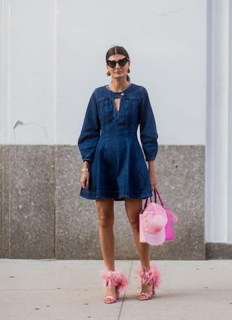 NEW YORK, NY - SEPTEMBER 10: Giovanna Engelbert wearing denim dress, pink heels and bag seen in the streets of Manhattan outside Diane von Furstenberg during New York Fashion Week on September 10, 2017 in New York City. (Photo by Christian Vierig/Getty Images)