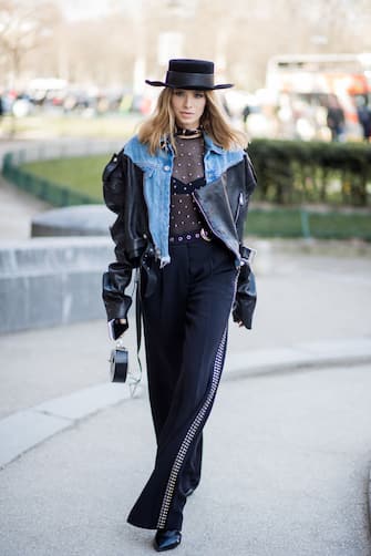 926910552 PARIS, FRANCE - MARCH 03: Lena Perminova wearing cowboy hat, sheer top, denim jacket is seen outside Elie Saab during Paris Fashion Week Womenswear Fall/Winter 2018/2019 on March 3, 2018 in Paris, France. (Photo by Christian Vierig/Getty Images)