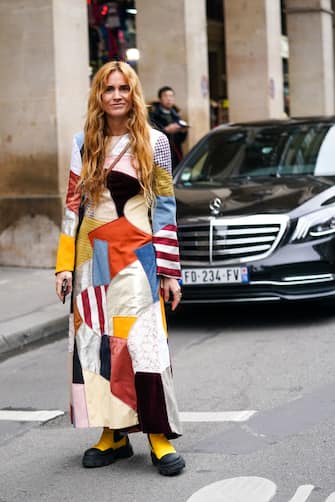 PARIS, FRANCE - FEBRUARY 28: Blanca Miro wears a multicolor patchwork long dress, yellow boots, outside Nina Ricci, during Paris Fashion Week - Womenswear Fall/Winter 2020/2021, on February 28, 2020 in Paris, France. (Photo by Edward Berthelot/Getty Images)