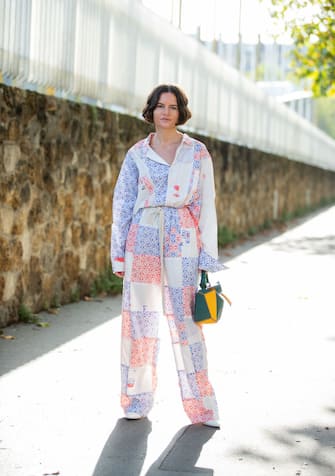 PARIS, FRANCE - SEPTEMBER 27: Marta Cygan is seen wearing checked overall with print, striped Loewe bag outside Loewe during Paris Fashion Week Womenswear Spring Summer 2020 on September 27, 2019 in Paris, France. (Photo by Christian Vierig/Getty Images)